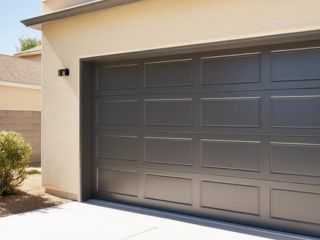 Modern Black Garage Door Replacement – Fern Park Project Close-up of a newly installed modern black garage door on a residential home in Fern Park, showing clean lines and a flawless finish.